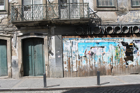 An image depicting an abandoned store front in Porto, Portugal, with weathered wood and crumbling cement, representing the passage of time and memory. Abandoned Store, Porto, Portugal, Original Photograph by Kim A. Bailey