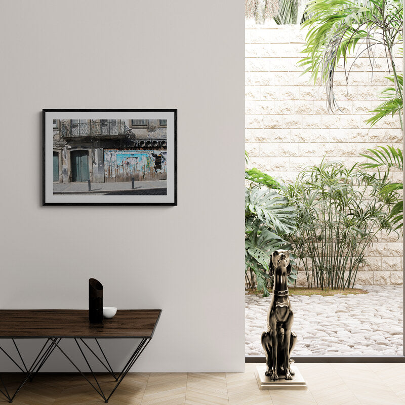 Living room with a framed picture, table, and statue overlooking a garden. Abandoned Store, Porto, Portugal, Original Photograph by Kim A. Bailey