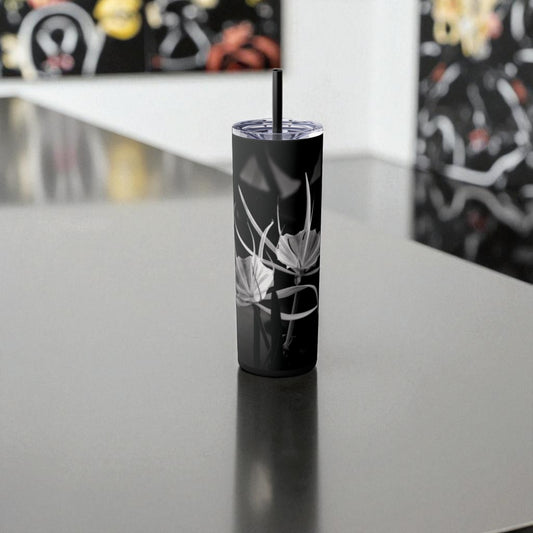 Black tumbler with floral design on a reflective surface