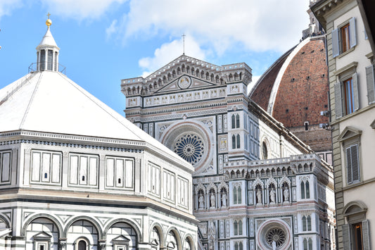 A photograph of the rooftops of Florence, Italy, featuring the Duomo and other architectural elements, with a composition of repeating shapes and a sense of visual cadence.
