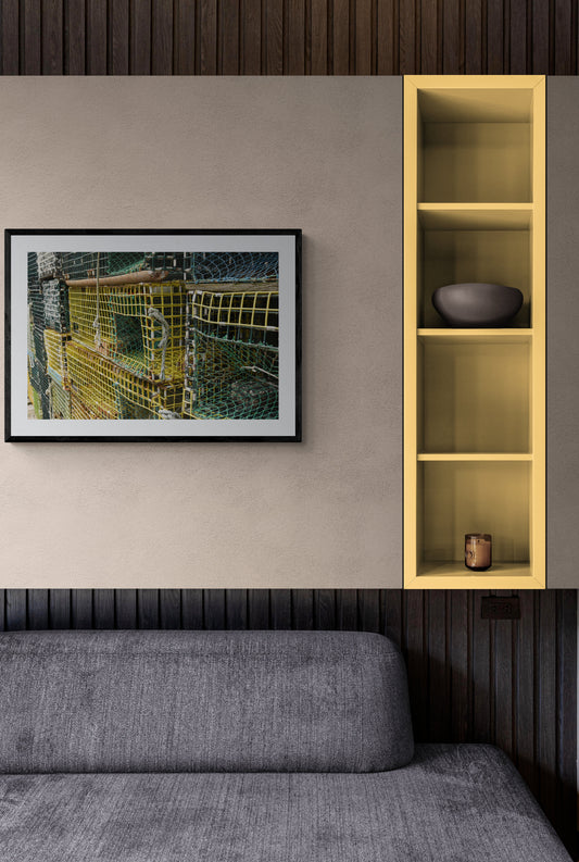 Modern living room with a sofa, wall art, and wooden shelf.