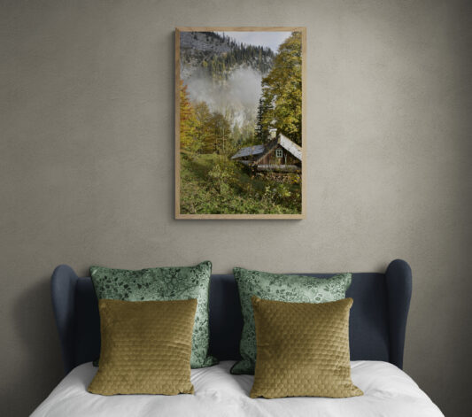 Cabin in Hallstatt, Original Photograph by Kim A. Bailey hanging over a bed