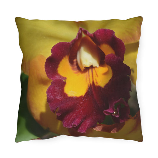 Pillow with a purple and yellow flower design on a white background