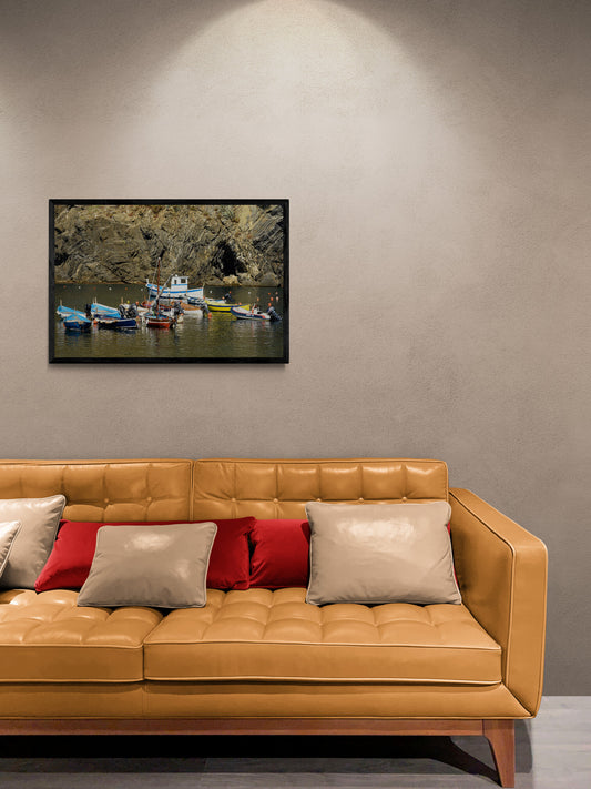 Fishing_Boats_in_the_Bay_Original_Photograph_by_Kim_A._Bailey hanging over a yellow leather couch.