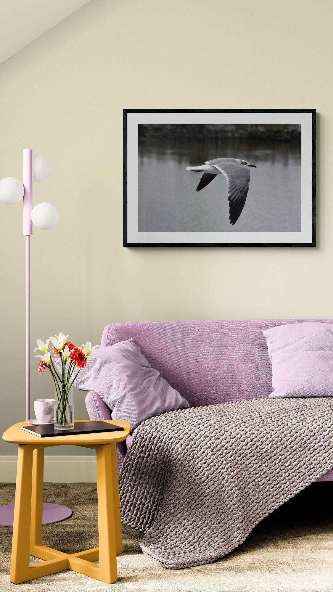Living room with purple sofa, gray blanket, and framed bird picture. Flying Seagull, Original Photograph by Kim A. Bailey