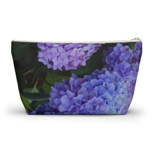 Makeup bag with purple floral design on a white background