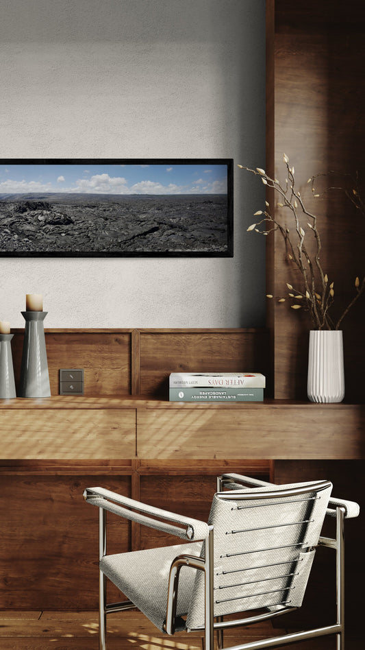 Dining room with wooden table, chair, and wall art. Kilauea Lava Field Panoramic, Original Photograph by Kim A. Bailey