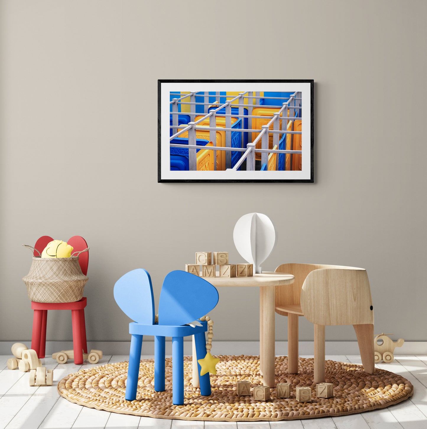 Children's furniture and toys in a room with a abstract painting on the wall.