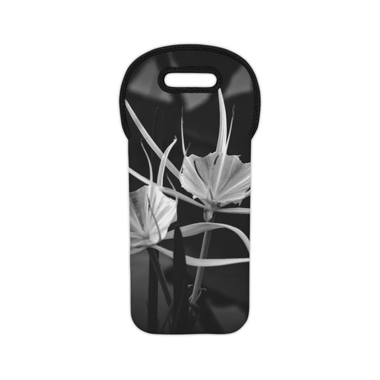 A black and white photograph of an alligator lily on a neoprene wine tote bag with a built-in carrying handle.