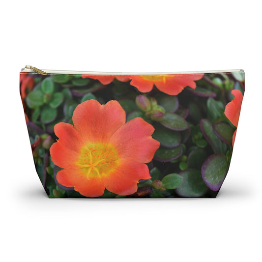 Makeup bag with orange flower design on a white background