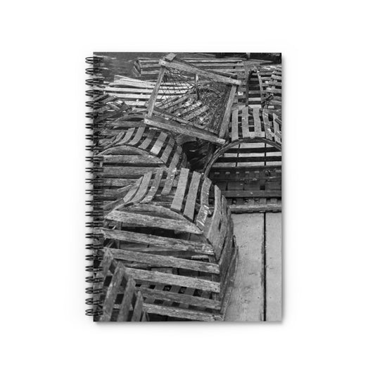 A spiral notebook with a black and white photograph of lobster traps on the cover.