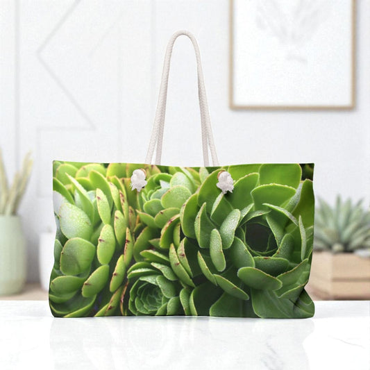 Tote bag with succulent plant design on a white surface