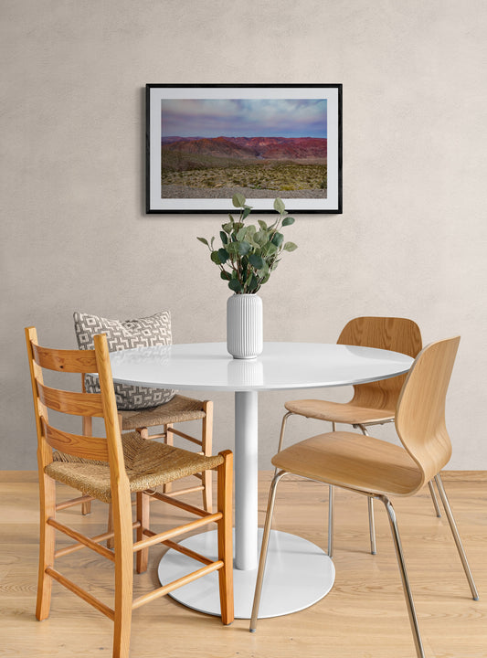 Dining room with a white round table and wooden chairs. Sunrise in Arizona