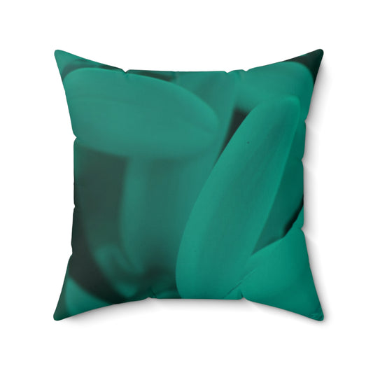 Green decorative pillow with a leaf pattern on a white background