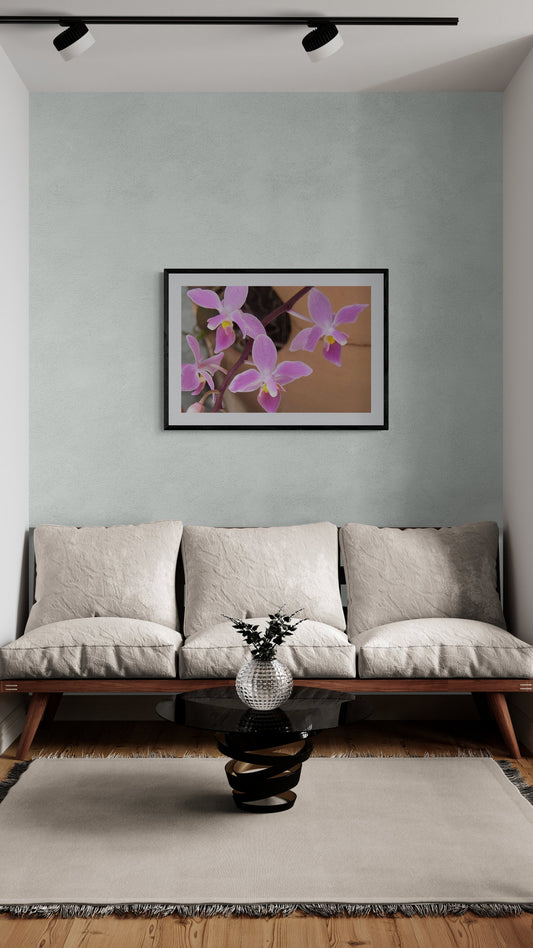 Living room with a sofa, coffee table, and wall art. Tiny Purple Ground Orchids, Original Photograph by Kim A. Bailey