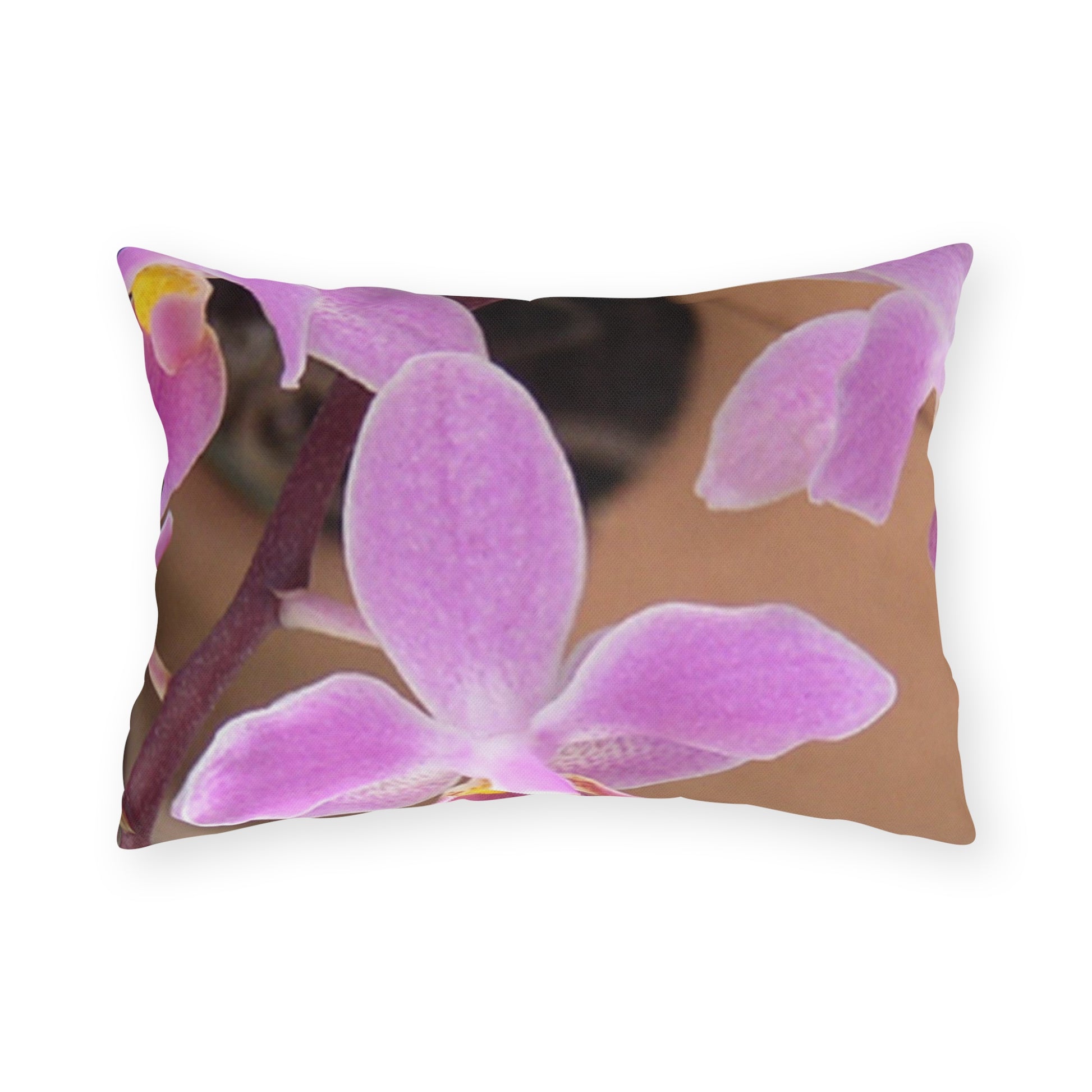 Decorative pillow with a pink orchid design on a white background