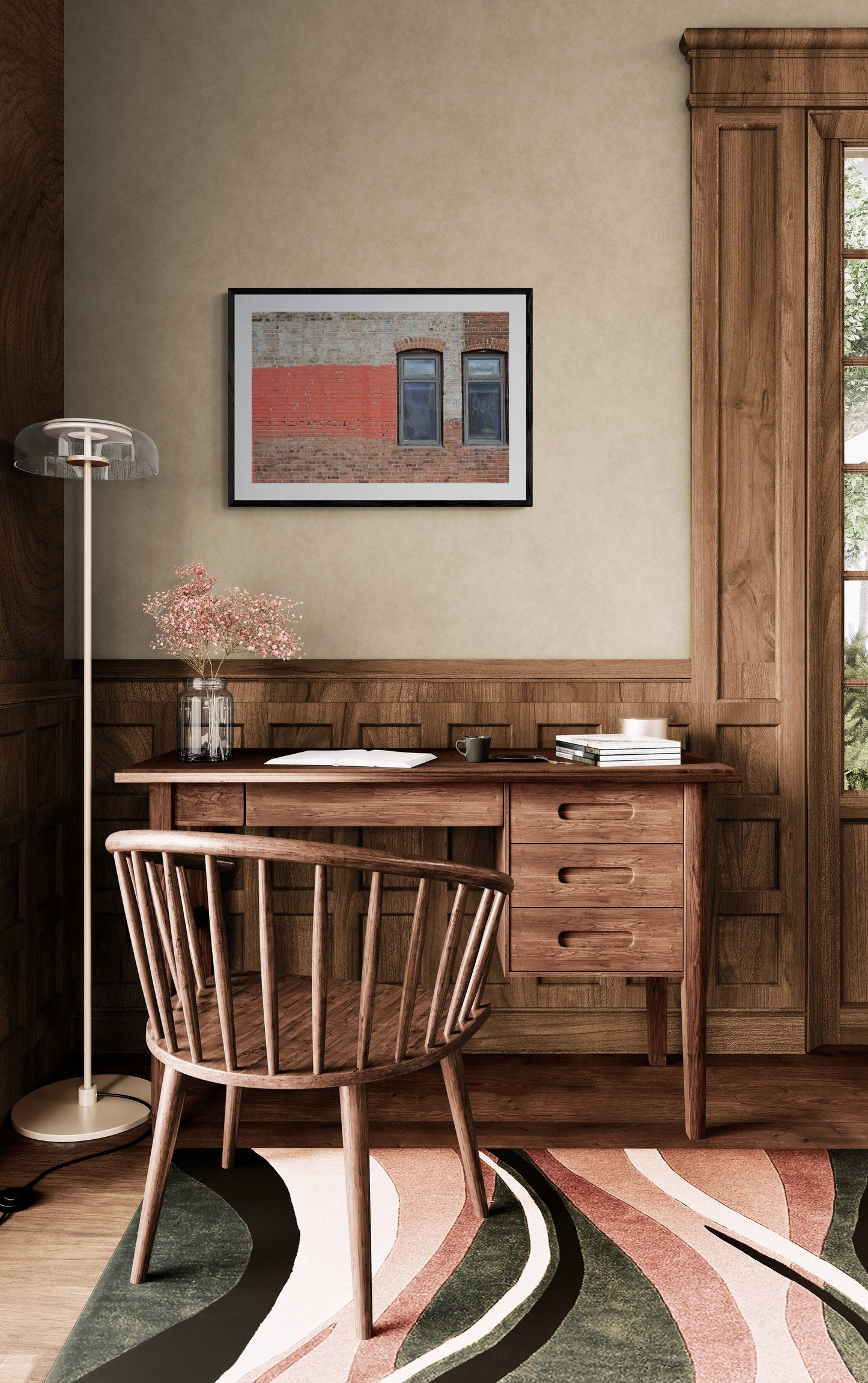 Wooden desk with chair in a room with a painting on the wall.