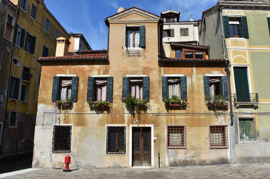 A color photograph of a historic Venetian home with elegant architecture, showcasing the rich architectural heritage of Venice, Italy. Venice Residence, Original Photograph by Kim A. Bailey