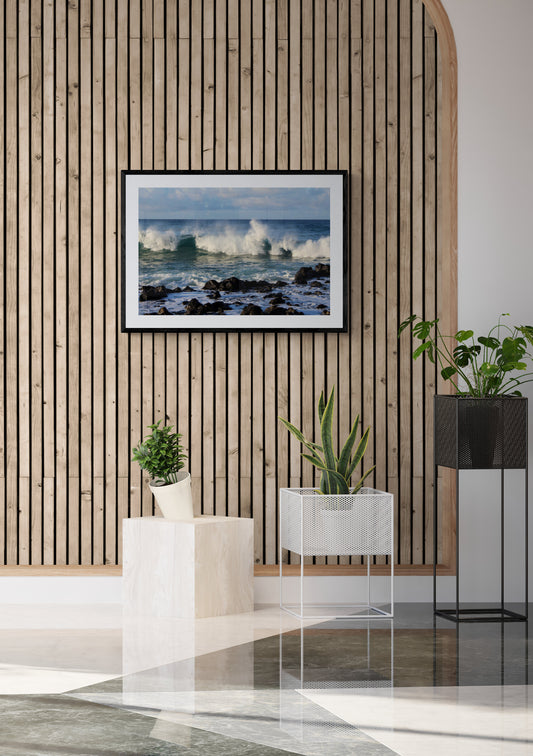 Modern interior with wooden wall paneling and ocean-themed artwork. Waves at Poipu Beach, Kauai, Hawaii, Original Photograph by Kim A. Bailey