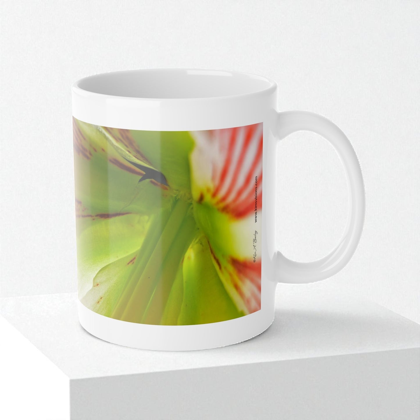 White mug with a colorful flower design on a white background