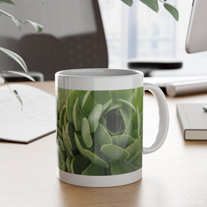 Mug with succulent plant design on a desk
