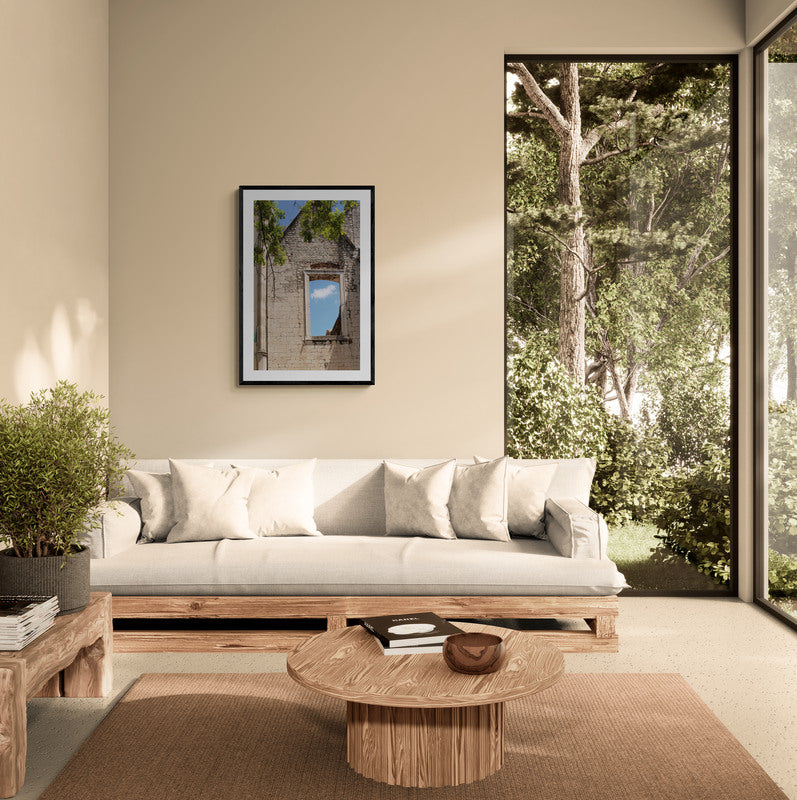 Modern living room with wooden sofa, coffee table, and large windows showing trees. Window to Sky, Original Photograph by Kim A. Bailey