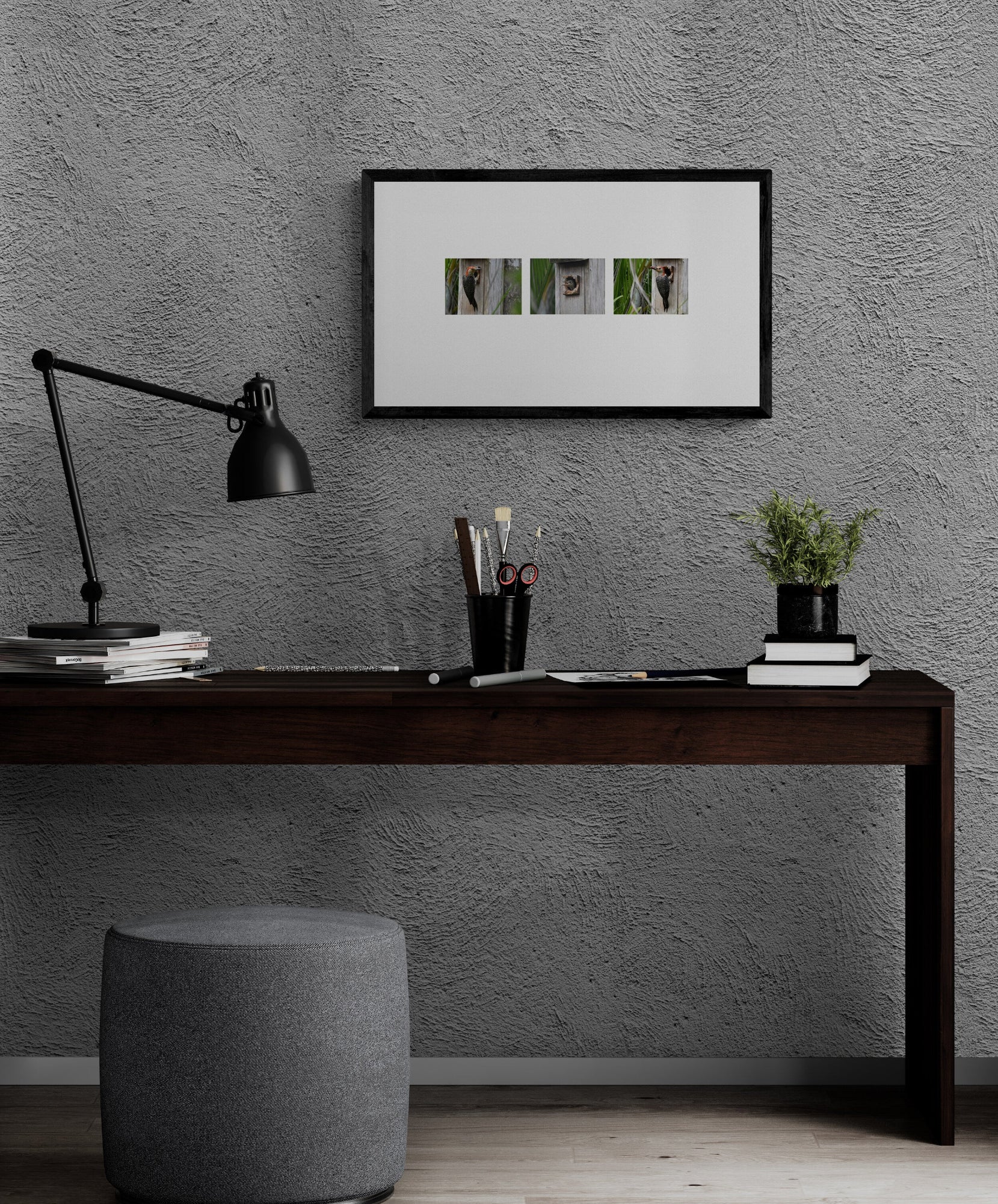 Modern home office with a desk, lamp, and framed artwork on a textured wall. Baby Woodpecker Being Fed by Parent, Photographic Triptych, Original Photograph by Kim A. Bailey