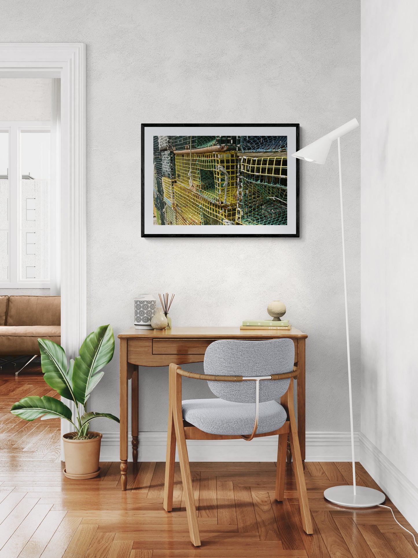 Modern home office with desk, chair, and artwork.
