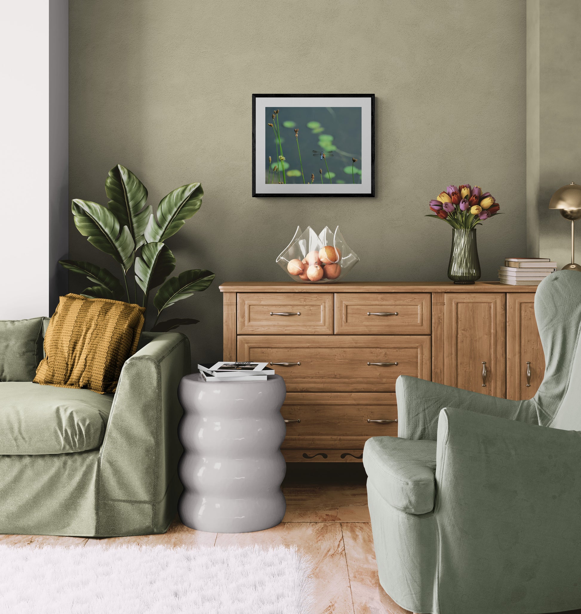 Living room with green sofa, wooden sideboard, and decorative items.