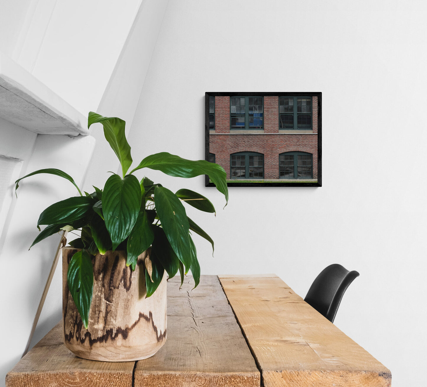 Potted plant on a wooden table with a chair and wall art in the background. Boat Museum Windows, Original Photograph by Kim A. Bailey