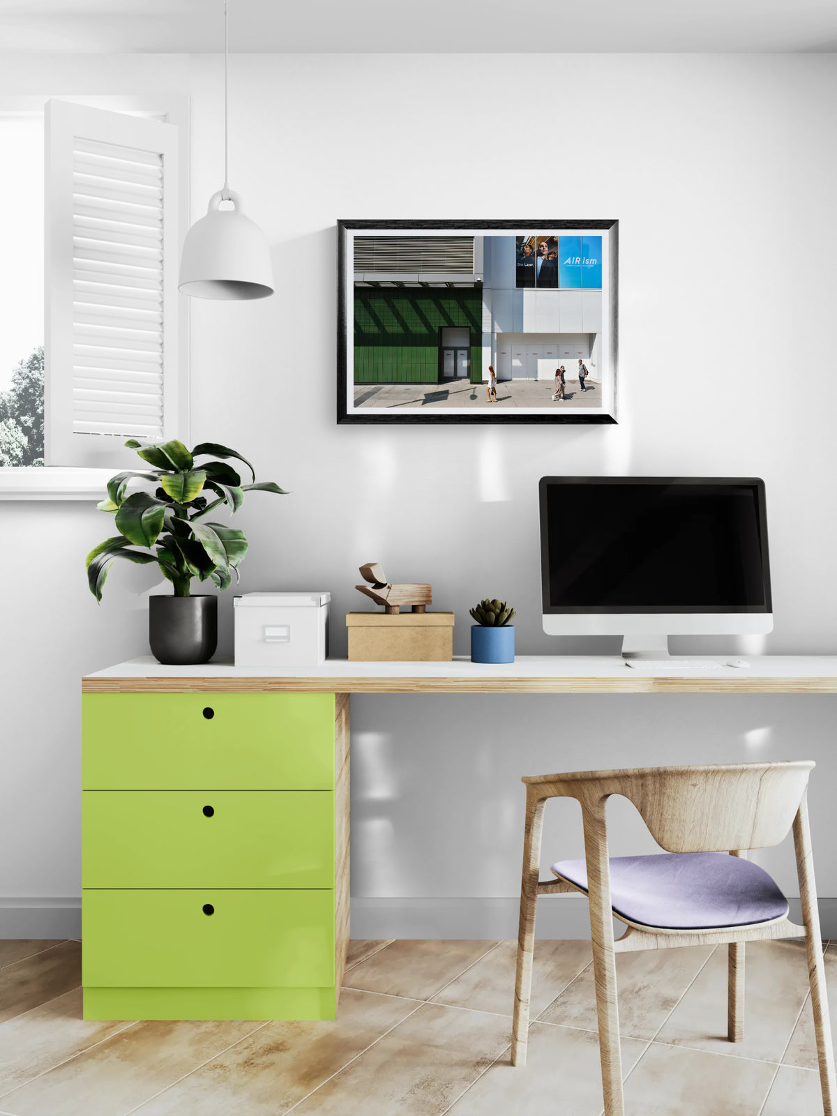Urban Photograph in big blocks of white, grey, blue, and green colors. People walking through the scene add scale. Hanging over a home office computer.