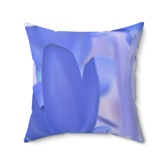 Decorative pillow with a blue floral pattern on a white background
