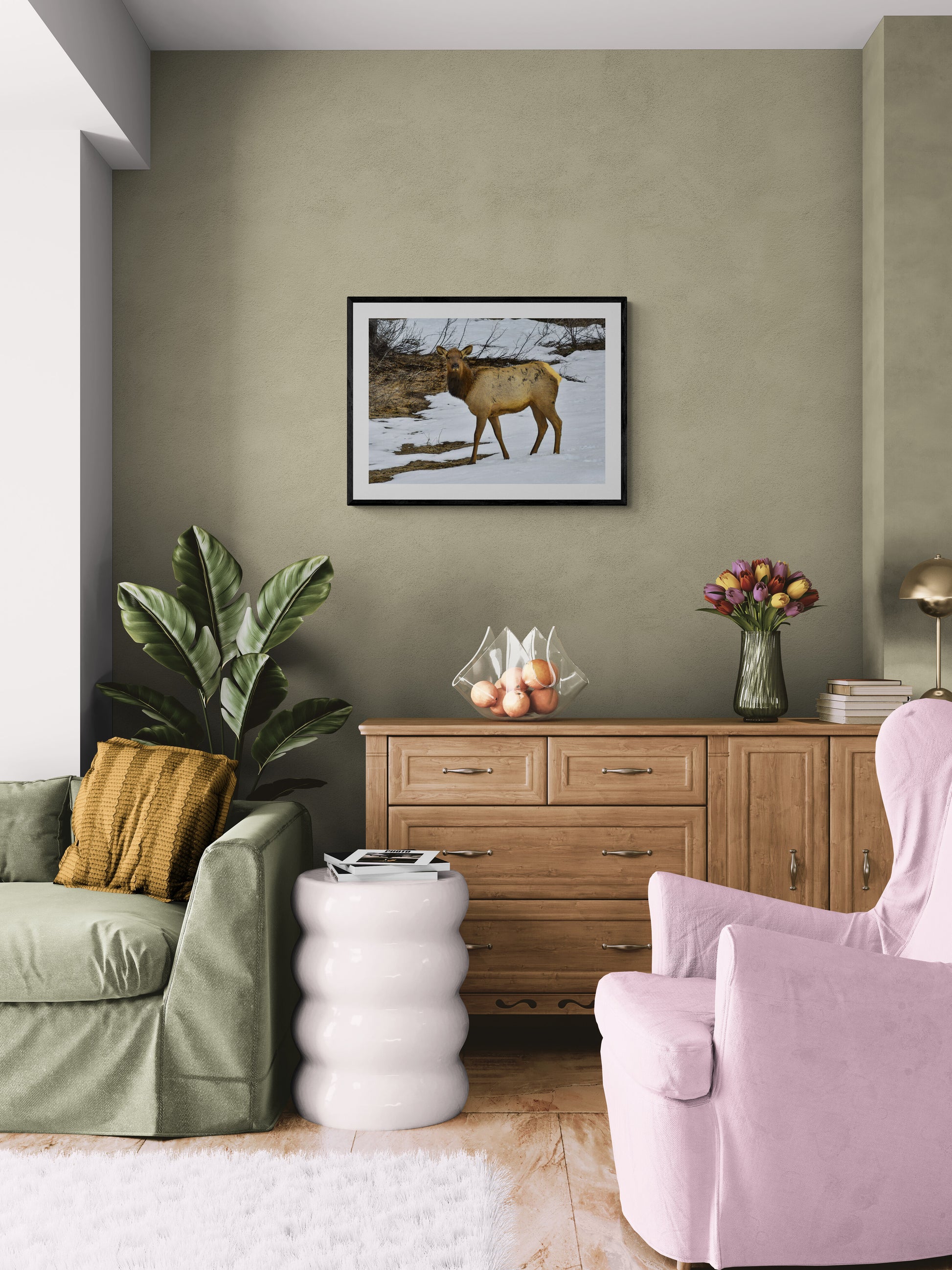 Living room with green walls, furniture, and decorative items.