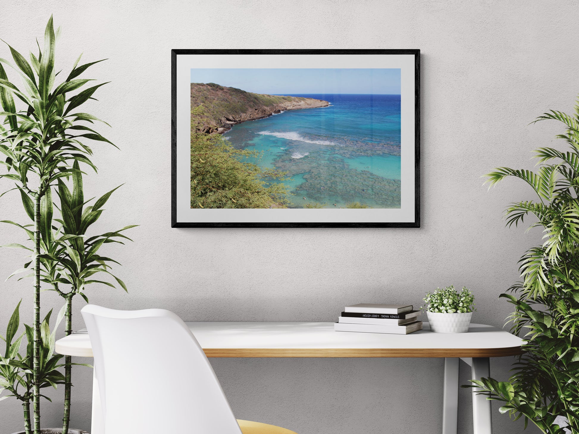 Framed photograph of a coastal landscape above a desk with plants. Hanauma Bay Surf Original Photograph by Kim A. Bailey