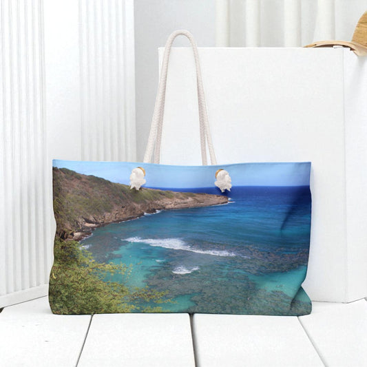 Tote bag with a scenic design of a coastal landscape on a white  Hanauma_Beach_Tote_Bag by kim a baileybackground