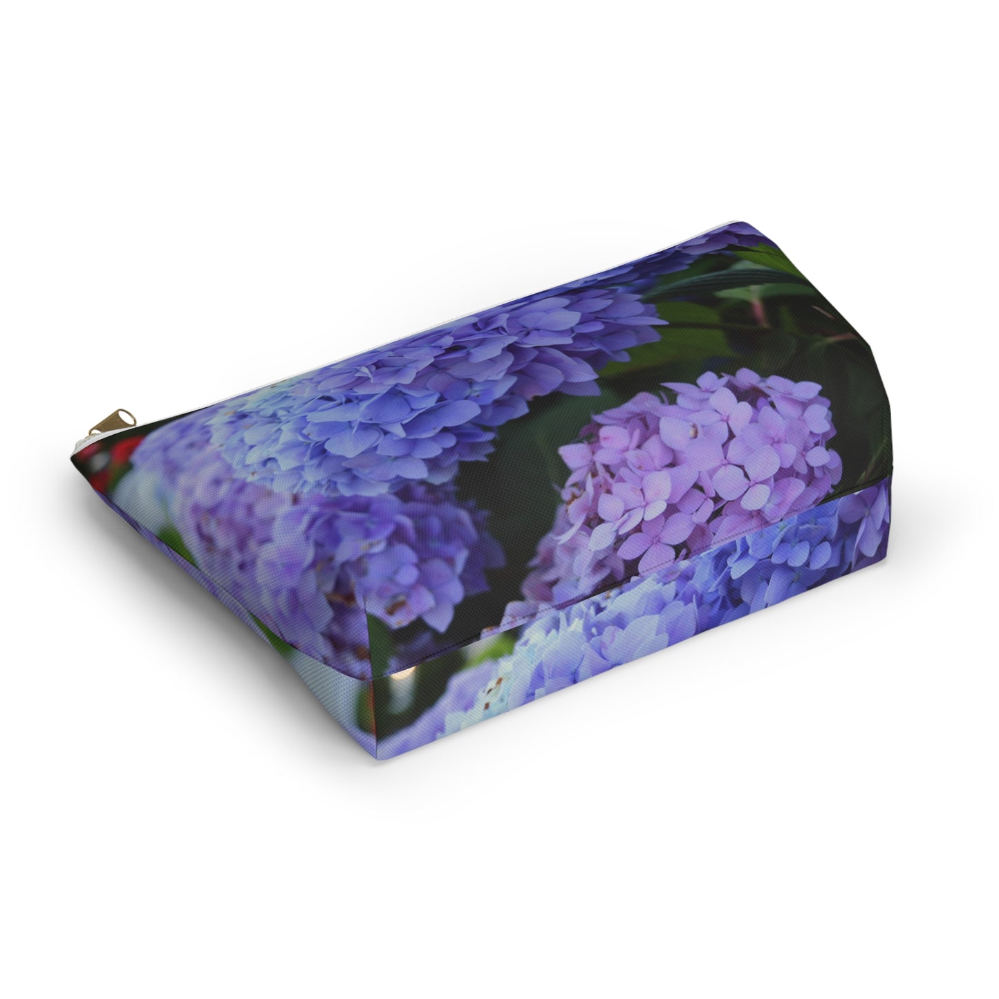 Pouch with purple floral design on a white background