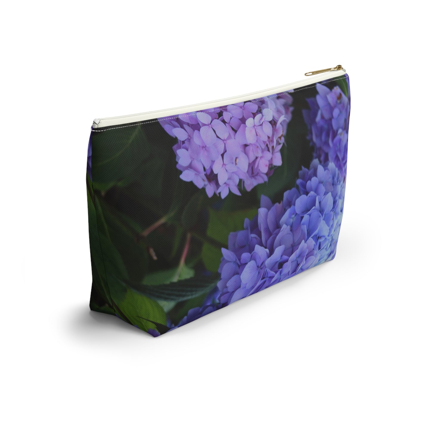 Pouch with purple floral design on a white background