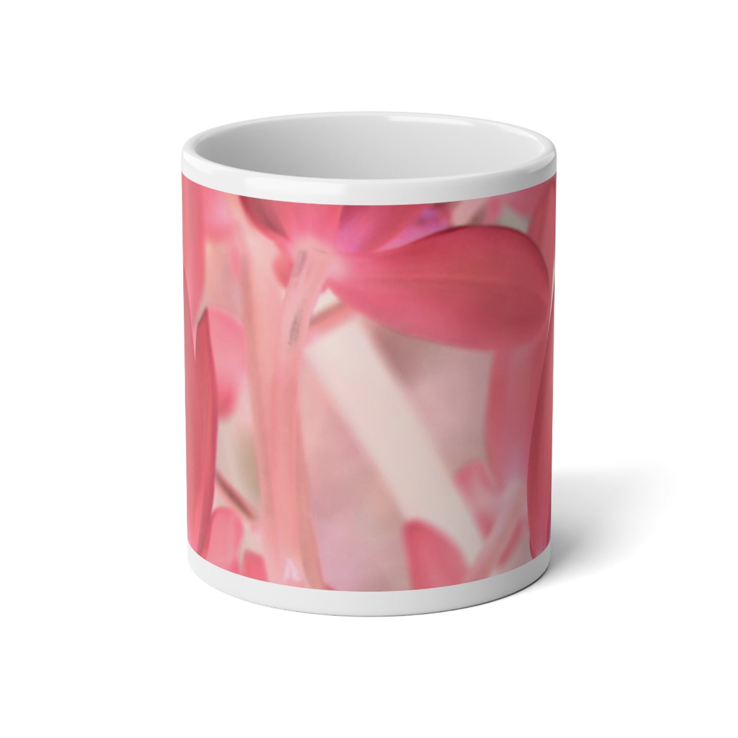 A white ceramic mug with a glossy finish featuring a pink tinted orchid design.
