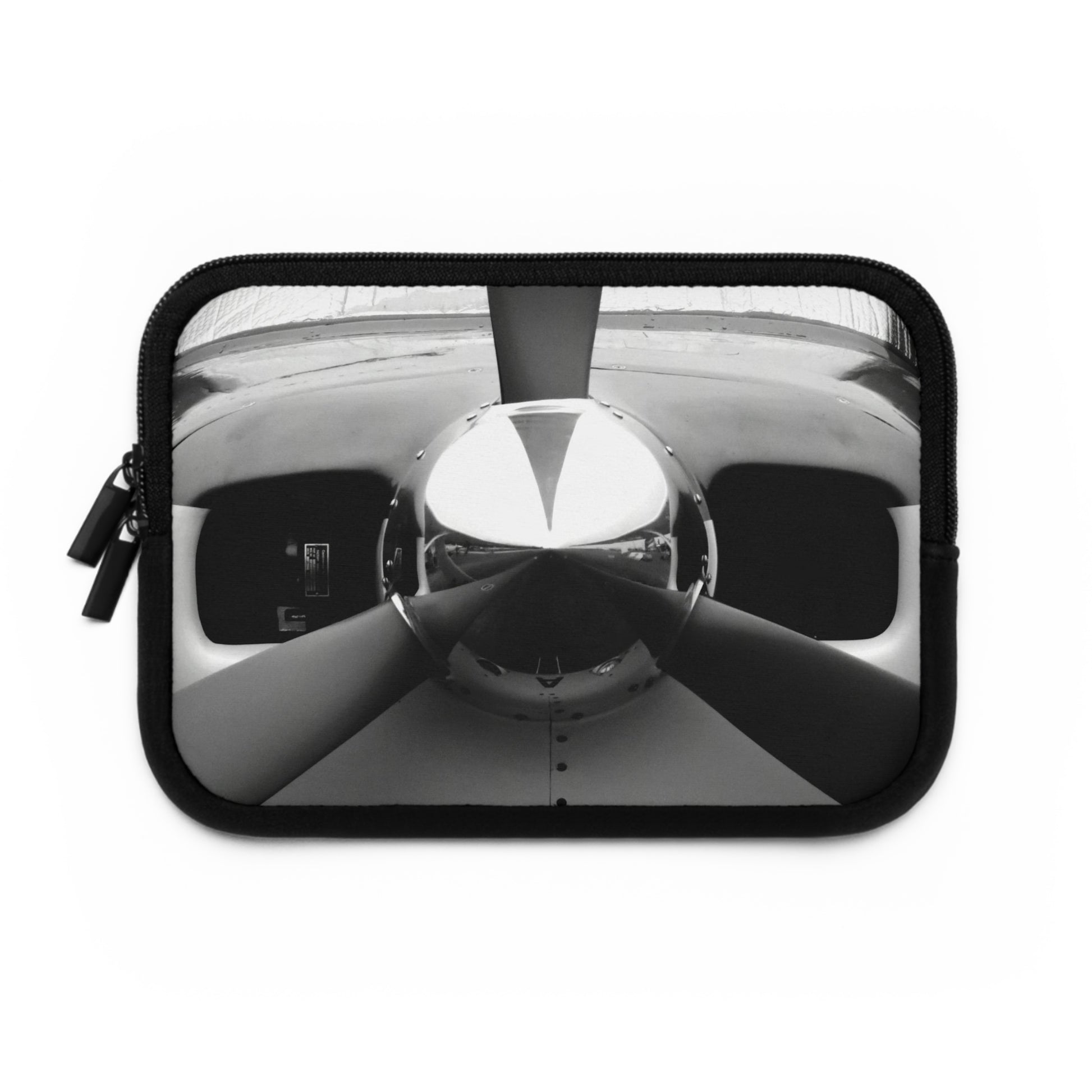 A neoprene laptop or tablet sleeve featuring a black and white photograph of a propeller on the front.