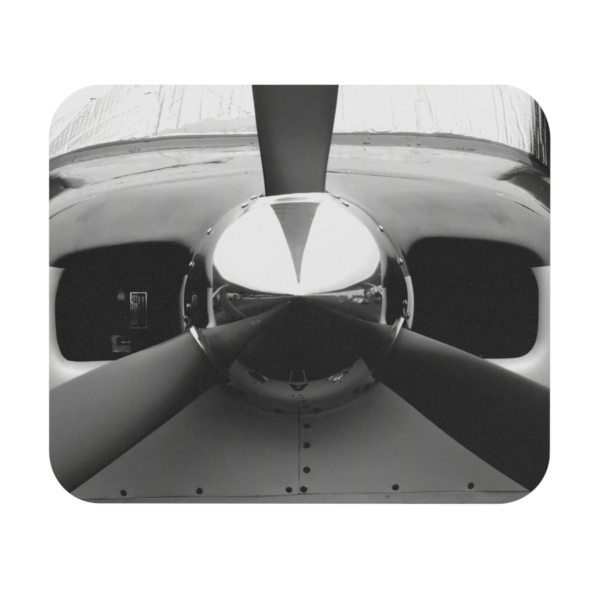 A mouse pad with a black and white photograph of a propeller in the center.