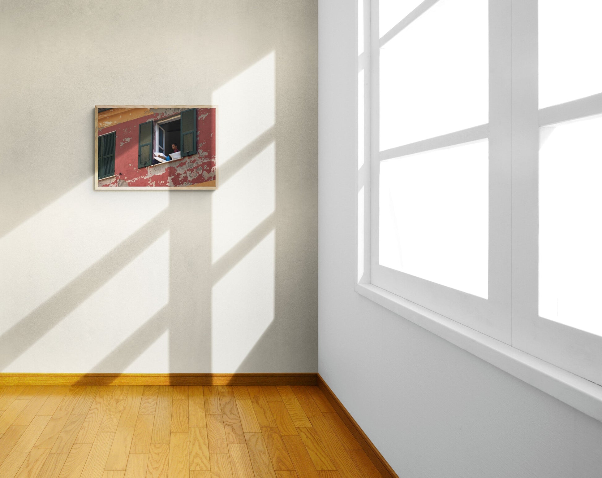 Room with sunlight casting shadows on a wall, featuring a painting. Open_Window_Original_Photograph_by_Kim_A._Bailey