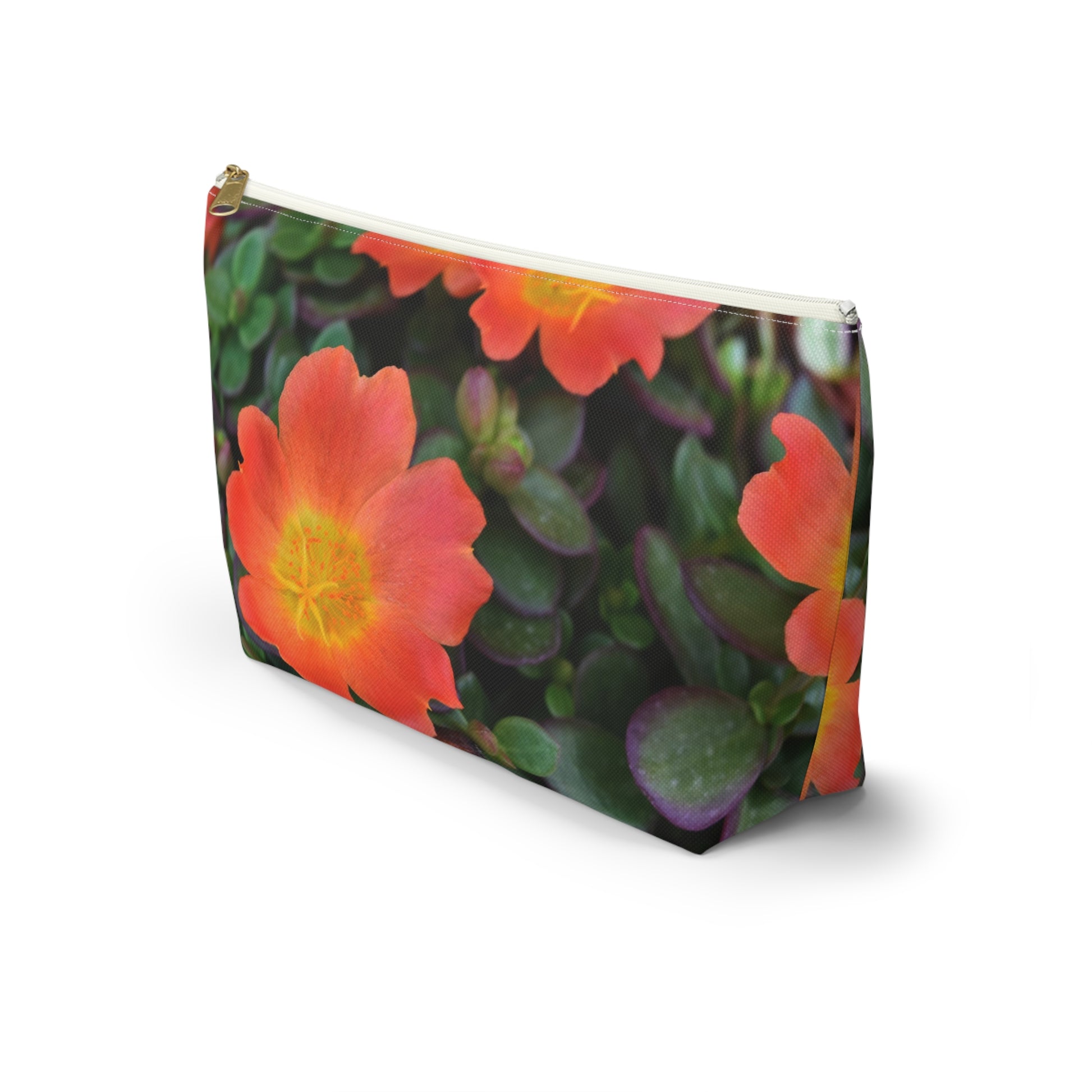 Pouch with a floral design featuring red flowers and green leaves on a white background