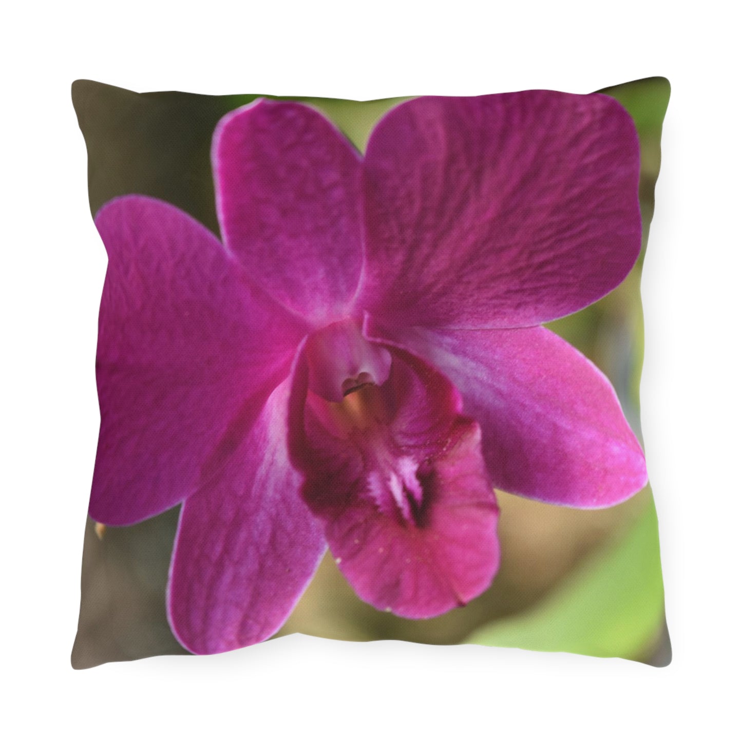 Pillow with a pink orchid design on a white background