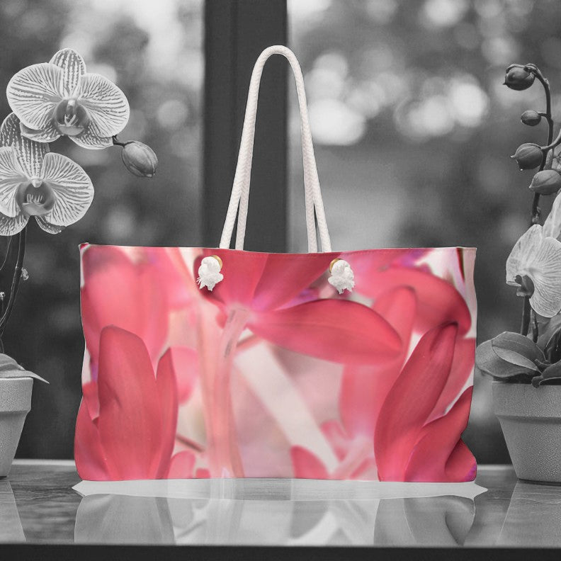 Tote bag with pink floral design on a blurred background