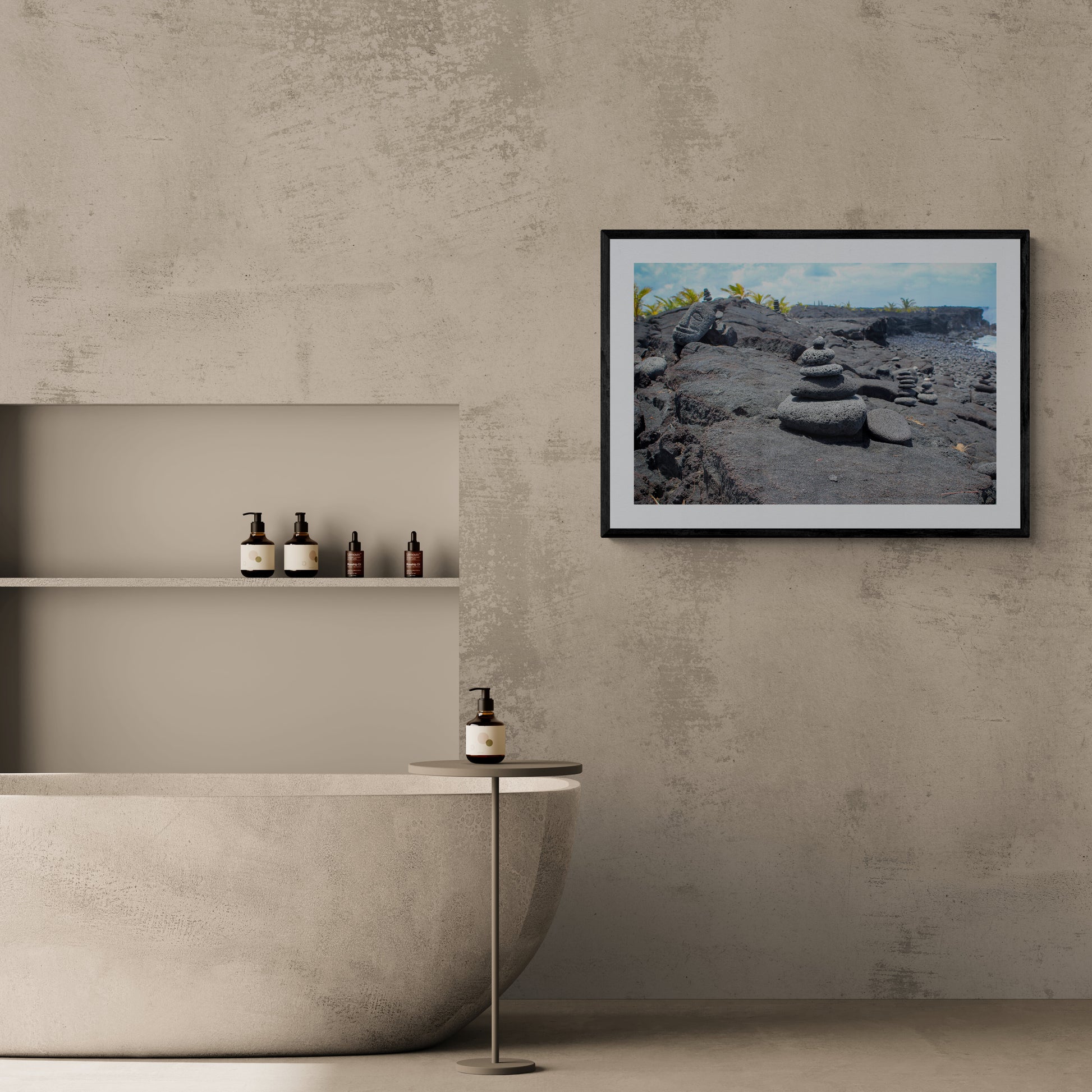 Modern bathroom with a stone bathtub and framed rock sculpture print.