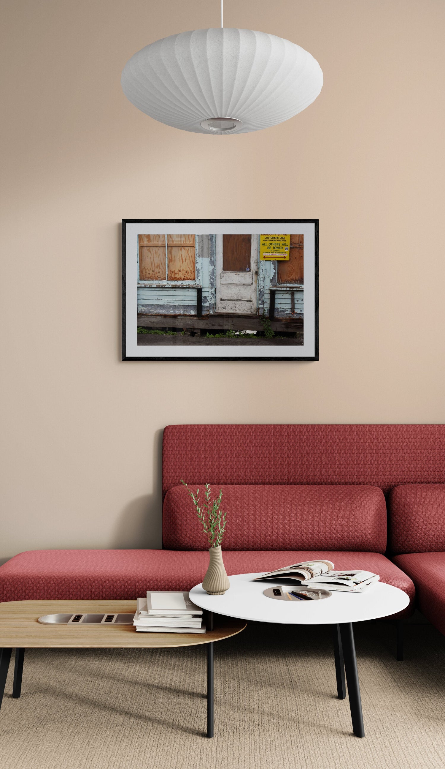 Living room with red sofa, white coffee table, and wall art. Weathered Lobster Store Original Photograph by Kim A. Bailey.