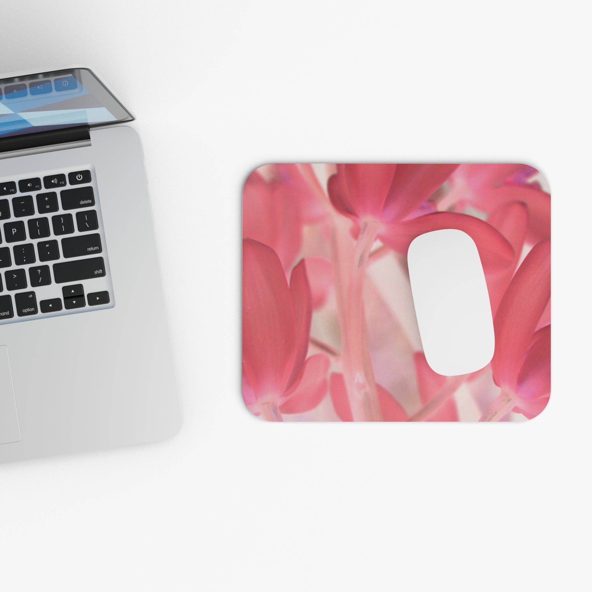 mouse pad with a pink tinted orchid by Kim Bailey