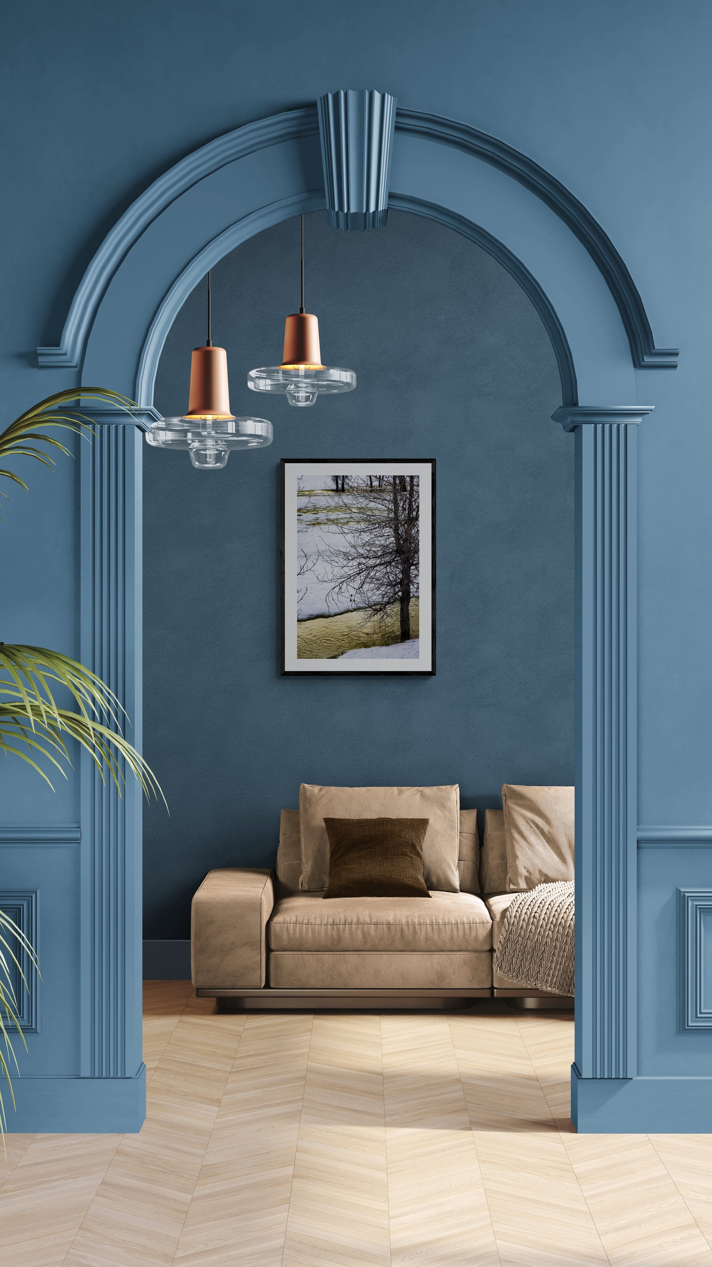 Brown sofa under an archway with blue walls and a painting.