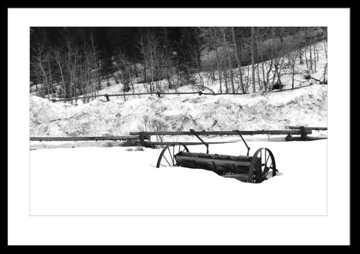 Framed Wagon Wheels in Snow, Original Photograph by Kim A. Bailey