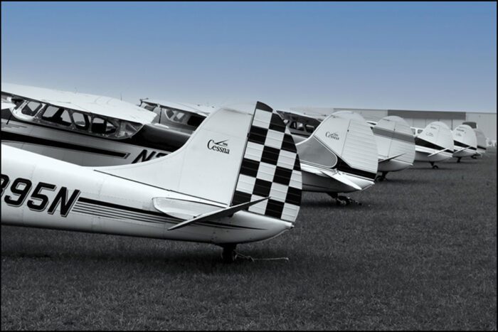 Black and White Cessnas Under Blue Sky, Original Photograph by Kim A. Bailey